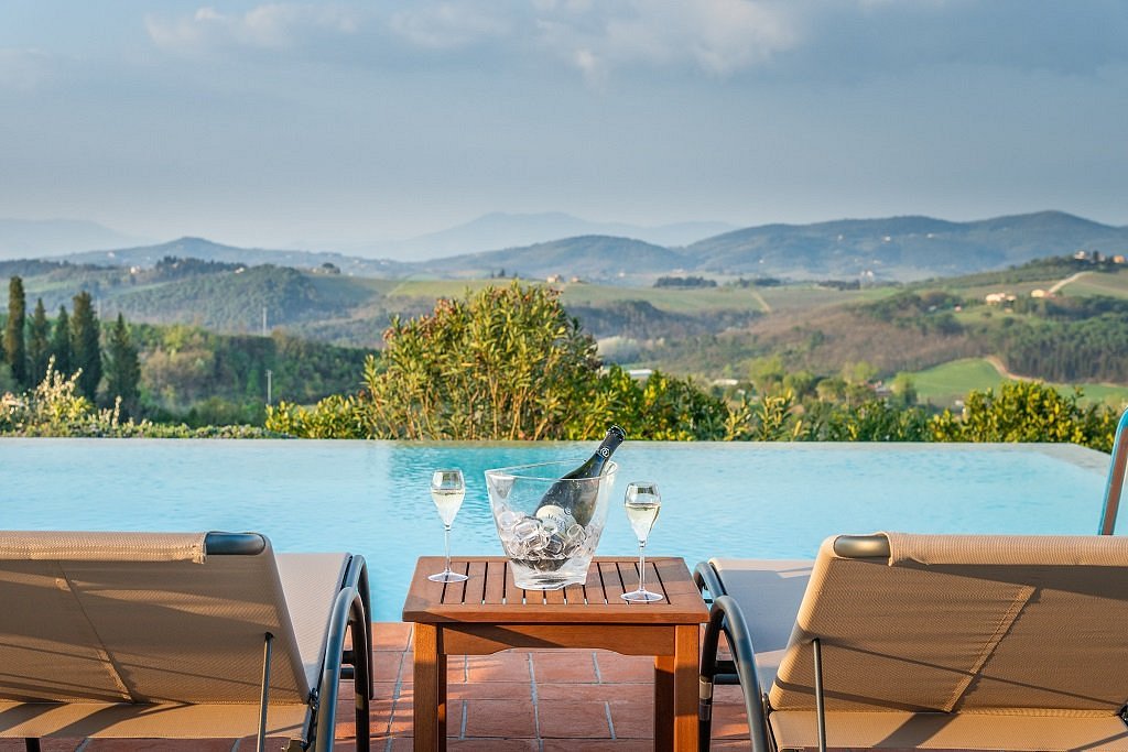 Champagne on ice by the infinity pool with views of the Tuscan hills